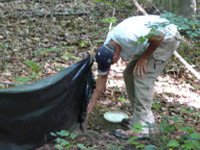 Mark Funk checks traps, photo credit: Bernie Solymar 